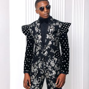 A “Vegas 2”, Floral pattern jacquard, Elevated shoulder and sleeve with Swarovski details peak Lapel tux suit